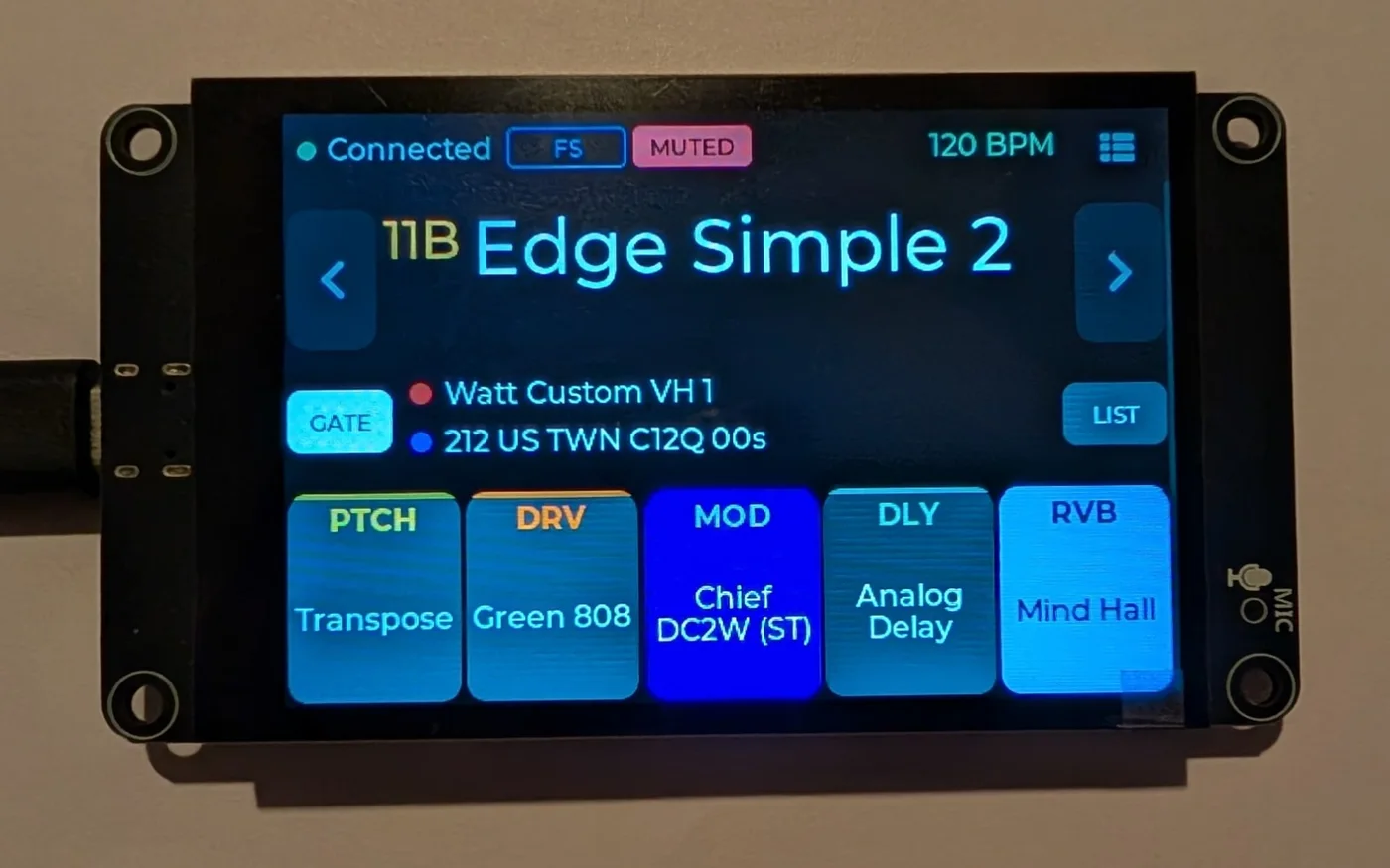 The ES3C35P on a wall, running NanoGig Screen's gig view with preset 11B, Edge Simple 2