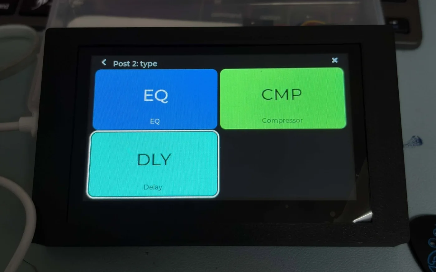 The JC4827W543 showing the effect types for a block after the amp: EQ, compressor and delay